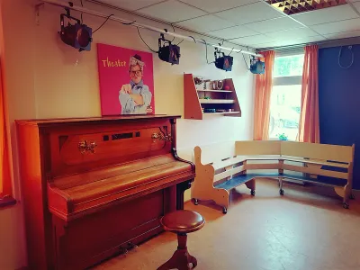KinderWORLD ism Zonnewiel/Olijfboom